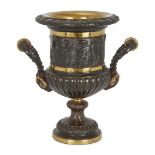 A French gilt and patinated bronze urn, late 19th century, the body cast with classical figures, the