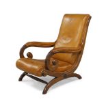 A William IV rosewood scroll armchair, with tan leather upholstery, raised on X-frame support joined