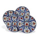 Four Dutch Delft plates c.1720-1740, De Paauw Factory marks, decorated in blue, green and red with