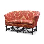 An 18th century French oak framed sofa, recently upholstered in a Zoffany chenille damask fabric,