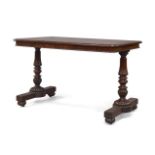 A William IV mahogany library table, by Gillows of Lancaster, the rounded edges with beaded