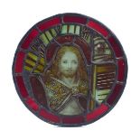 A circular stained glass roundel, 18th century and later, depicting Christ with long flowing hair,