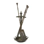 An English cast-iron fire-tool stand, early 20th century, modelled as Chinese figure with out-