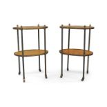 A pair of French oval brass side tables, two tiers with figured walnut veneer, raised on castors,