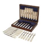 A wood cased set of mother-of-pearl handled silver fruit eaters, Sheffield, 1946, William
