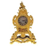 A French gilt bronze Rococo Revival mantel clock, second quarter 19th century, the Rococo style case