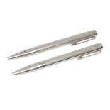 A cased pair of silver ballpoint pens, London, 2014, SJ, of engine turned design, 13.5cm