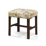 A George III small rectangular mahogany stool, circa 1770, with a stuffed seat, on square legs,