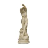 An Italian marble model of a seated nude, c.1900, depicted seated on rocks, her feet dipping in