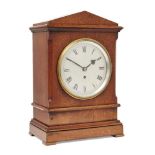 An Edward VII mahogany cased fusee mantel timepiece, circa 1905, the architectural case with