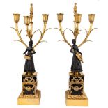 A pair of Louis-Philippe gilt and patinated bronze three-light figural candelabra, c.1840, one