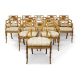 A set of twelve Regency style caned beech chairs, floral decoration, lattice backrest, floral