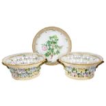 A pair of Royal Copenhagen Flora Danica reticulated circular fruit baskets, 20th century, painted to