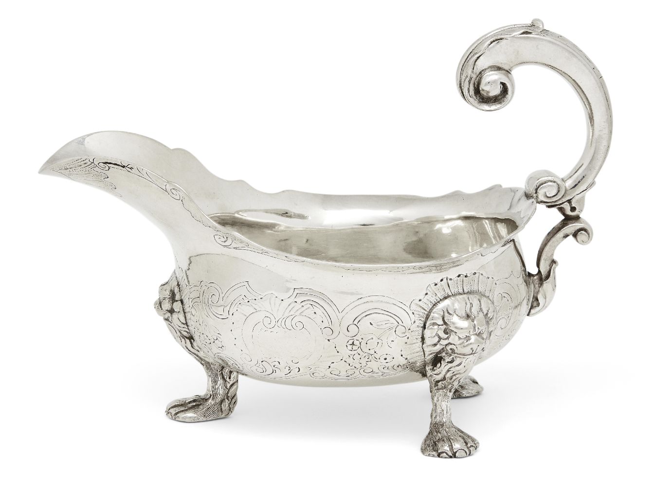 A George II silver sauce boat, London, c.1748, maker's mark rubbed, designed with three paw feet