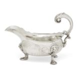 A George II silver sauce boat, London, c.1748, maker's mark rubbed, designed with three paw feet