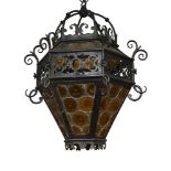 An Edwardian wrought iron hexagonal hanging lantern, early 20th century, tapering body with