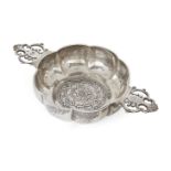 A George V silver porringer with Tudor rose design to base, London, 1929, J. Parkes & Co., the