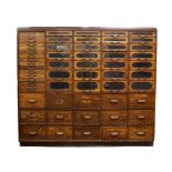 A late Victorian mahogany Haberdashery cabinet, c.1880, with fifteen short drawers beside twenty-