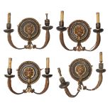 A set of four Regency black and gilt painted twin branch wall appliques, later converted to