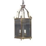 A George III style brass hexagonal hall lantern, with bevelled glass panels, 94cm high, 46cm wide,