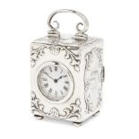 A small Edwardian silver boudoir clock, London, 1901, William Comyns & Sons, the circular white