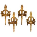 A set of four French gilt-bronze twin-light wall appliques, late 19th century, the backplates cast