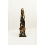 A large variegated marble obelisk, 20th century, of typical form, 56cm high Please refer to