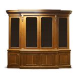 A Victorian light oak breakfront library bookcase, the stepped cornice with rounded edges, above