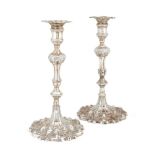 A matched pair of silver candlesticks, one London, 1764, Ebenezer Coker, the other London, 1828,