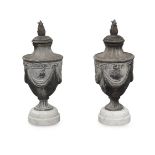 A pair of lead urns and covers, in Neo-classical style, 20th century, raised on stepped circular