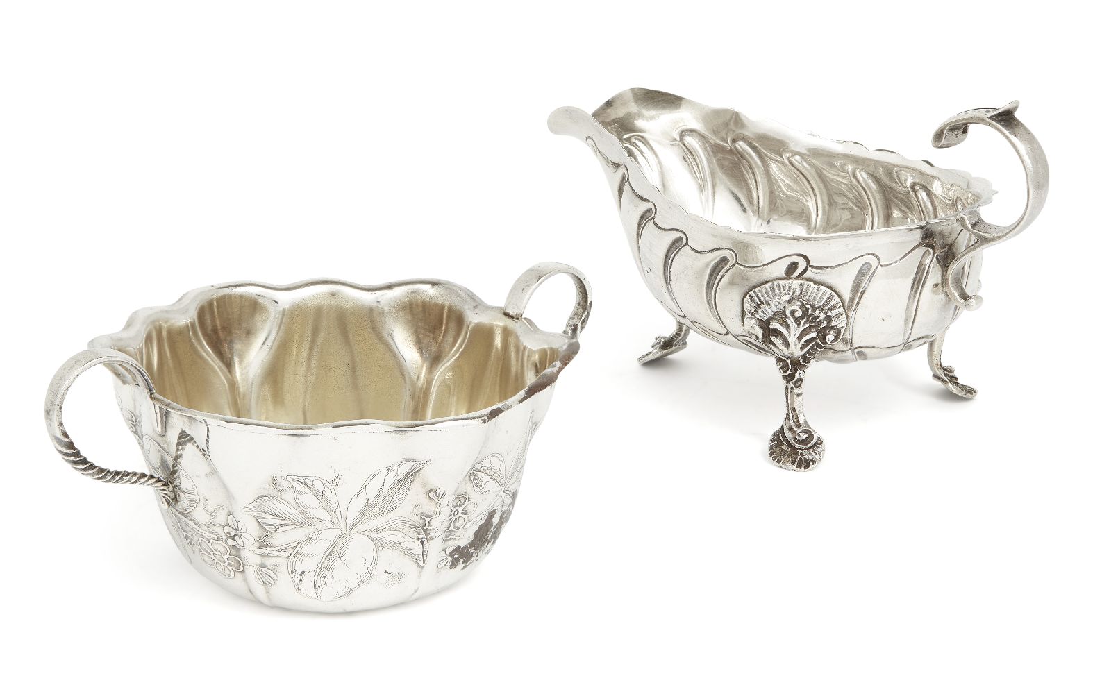 A Victorian Irish silver sauce boat Dublin, 1898, Charles Lambe, raised on three shell and foliate