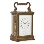 A French brass carriage repeating clock with alarm, 19th century, the brass case with floral