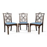 A set of three George III mahogany side chairs, circa 1765, with Chinoiserie pierced fret-carved