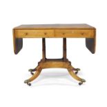 A Regency rosewood sofa table, early 19th century, with one drawer and one faux drawer to each side,