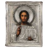 A Russian icon of Christ Pantocrator, the silver repoussÃ© and chased oklad circa 1908-1926, stamped