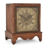 A mahogany mantel timepiece, circa 1900, the square mahogany case on bracket support with shaped