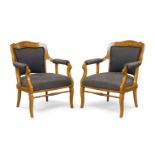 A Pair of French maple and elm armchairs, 19th Century, circa 1840, raised on sabre legs with ring