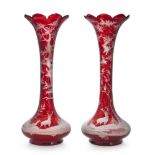 A pair of Bohemian ruby glass vases, early 20th century, of tapering form, the bodies decorated with