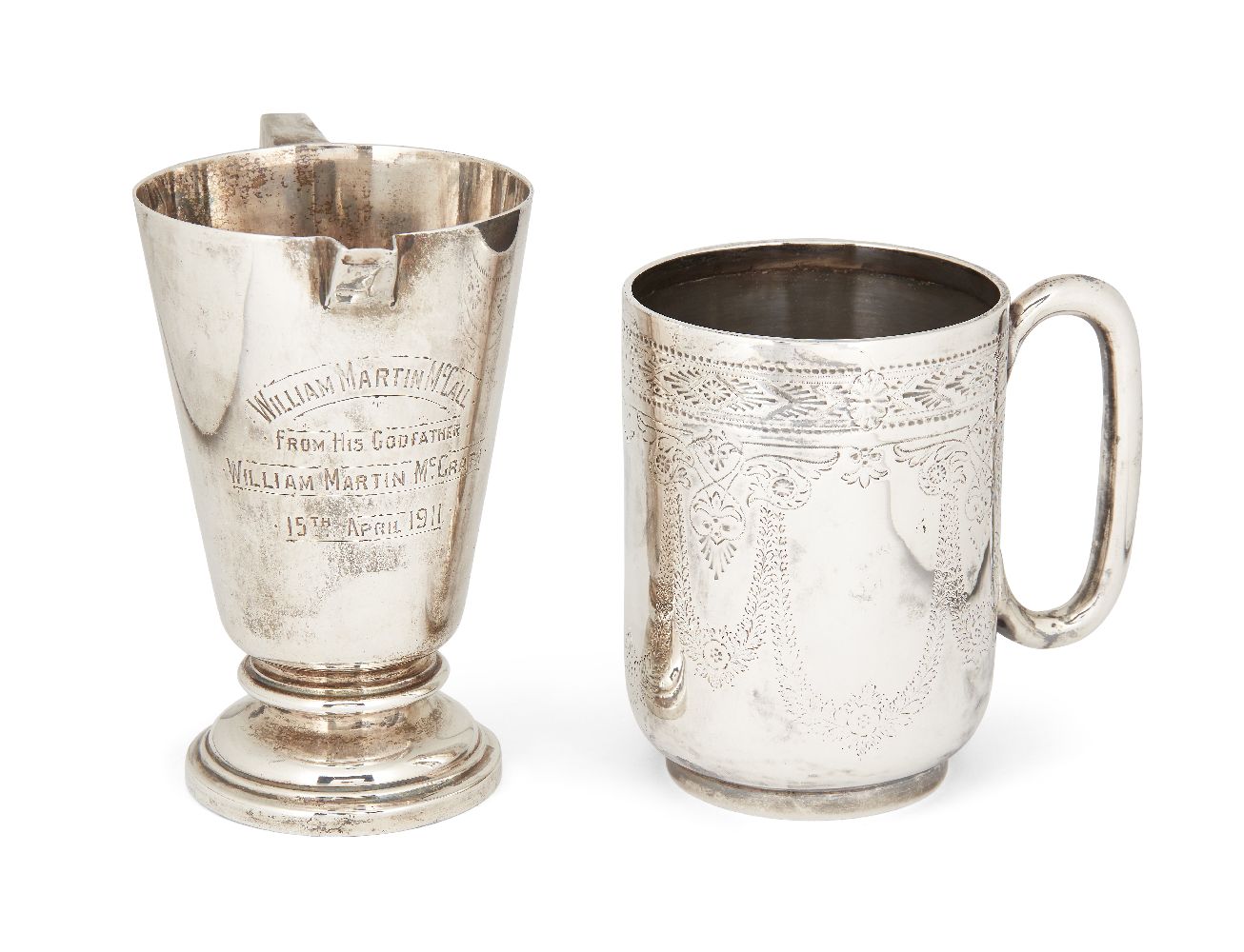 A silver Walker & Hall cream jug, Sheffield, 1910, of tapering form with angular handle and