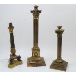 Three gilt and patinated bronze column table lamps, 19th century, comprising: one with Corinthian