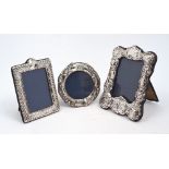 A silver mounted photo frame, repousse decorated with putti and foliate scrolls, London, 1978,