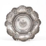 A Qajar silver sweets dish, 20th century, Iran, with openwork rim, a series of six ovals depicting