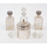 Two silver mounted glass vanity bottles, Birmingham, 1897, C. May & Sons, the rectangular cut