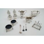 A group of silver comprising: two cream jugs, (one with circular foot, Birmingham, 1920, S W Smith &