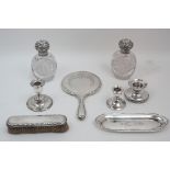 A group of silver comprising: two Victorian silver mounted cut glass vanity bottles, Birmingham,