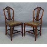 A set of six Edwardian Hepplewhite style mahogany dining chairs by Waring and Gillows, circa 1910,