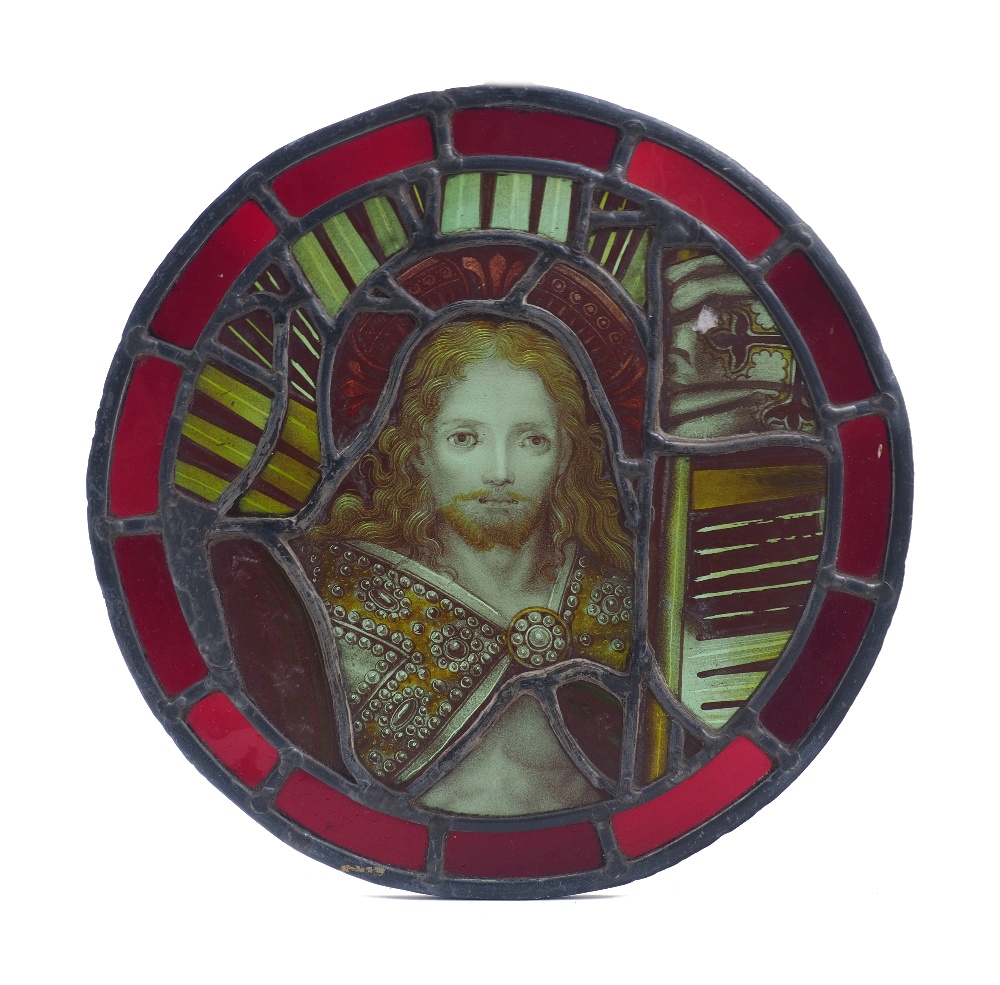 A circular stained glass roundel, 18th century and later, depicting Christ with long flowing hair,