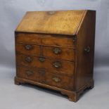 A Queen Anne walnut bureau, circa 1710, the drop flap enclosing fully fitted interior with