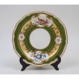 A New Hall Pottery side plate, circa 1810, decorated with vignettes of a bird and flowers within