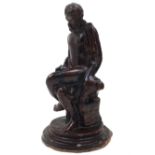 A glazed terracotta model of Vulcan, late 19th century, depicted seated on an anvil, a hammer in his